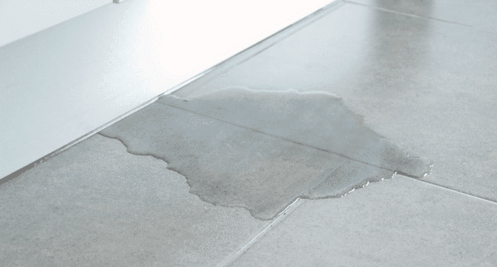 water pooling on floor caused by slab leak